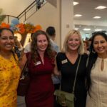 Four ladies posing at the lobby during a grand opening