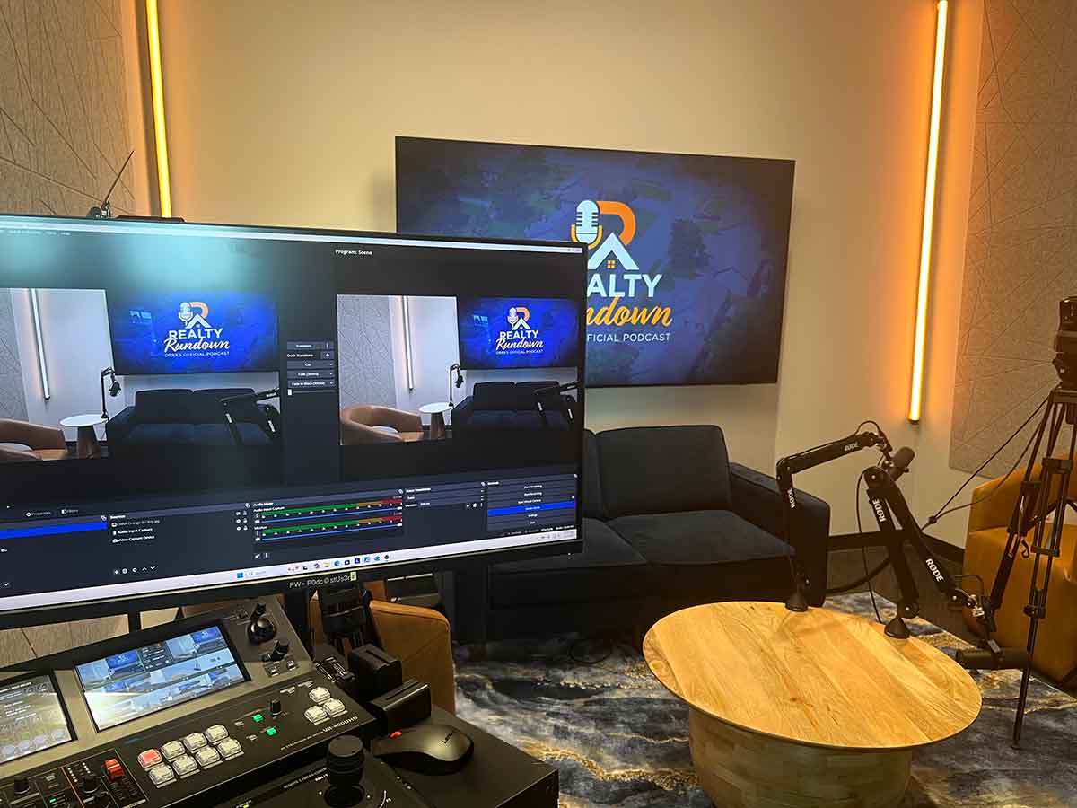 Podcast Room showing TV and small control table